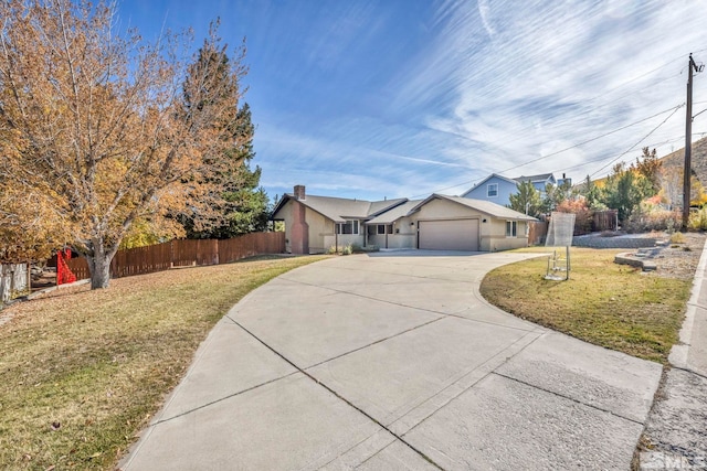 single story home featuring a front yard and a garage