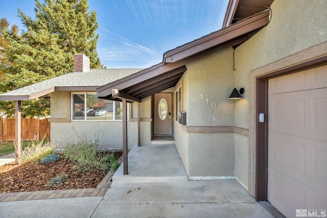 doorway to property featuring a garage