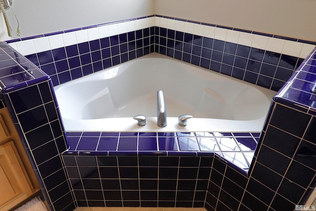 bathroom with tiled bath