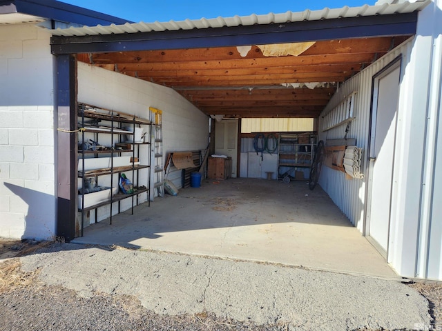 view of vehicle parking with an exterior structure
