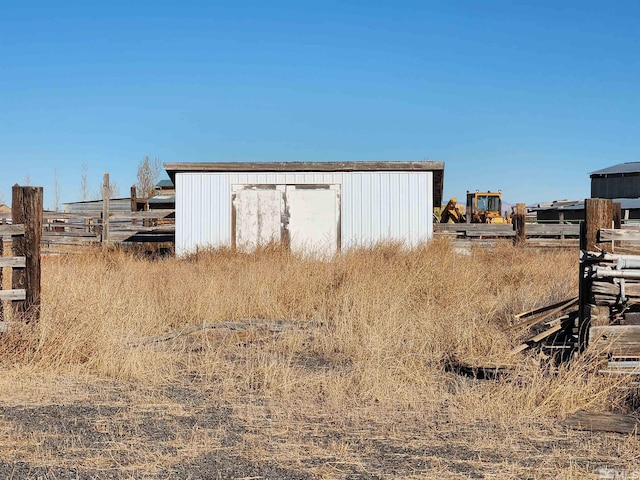 view of shed with fence