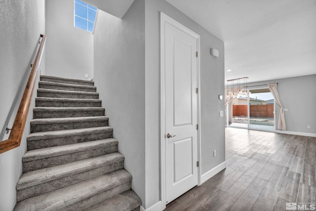 stairway featuring hardwood / wood-style flooring