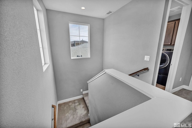 stairs featuring washer / clothes dryer