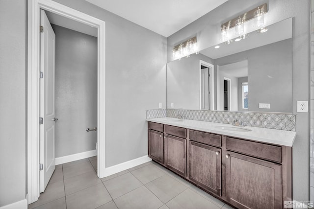 bathroom featuring vanity, tile patterned floors, and toilet