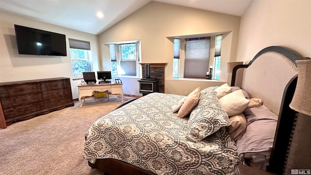 carpeted bedroom with lofted ceiling