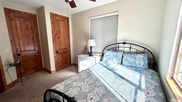 bedroom featuring light colored carpet and ceiling fan