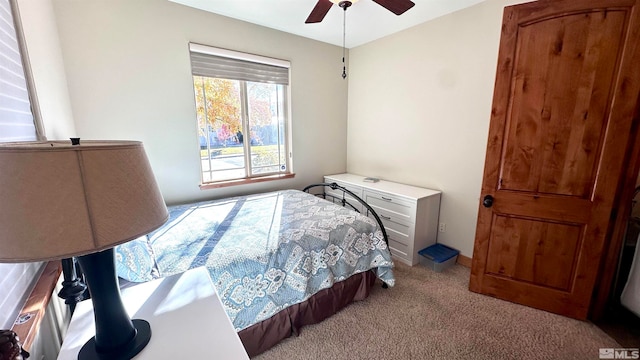 bedroom with light colored carpet and ceiling fan