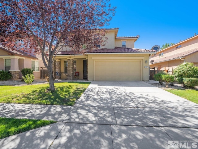 mediterranean / spanish home with a front yard