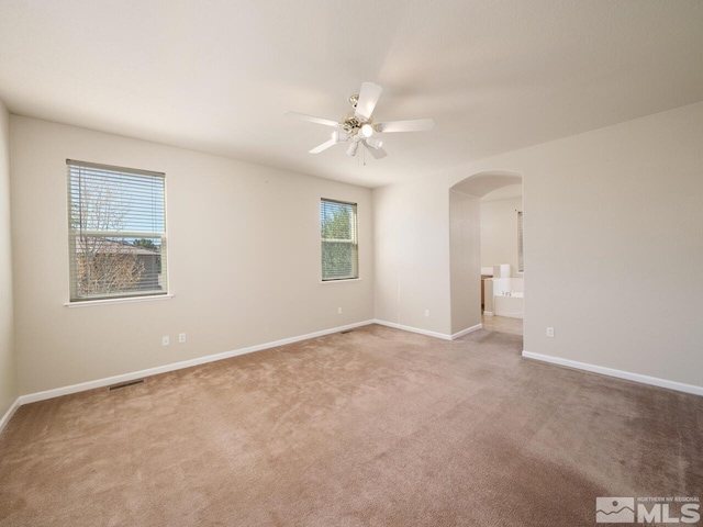 carpeted empty room with ceiling fan