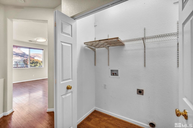 washroom with hardwood / wood-style floors, washer hookup, and electric dryer hookup