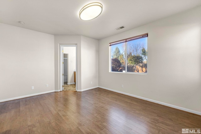 spare room featuring hardwood / wood-style floors