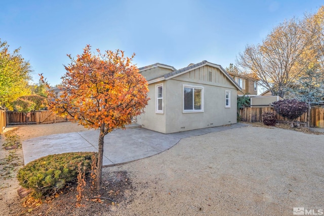 rear view of house with a patio