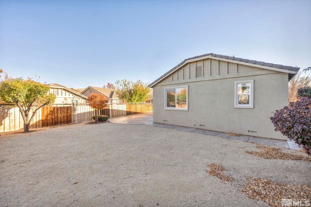 view of property exterior featuring a patio area