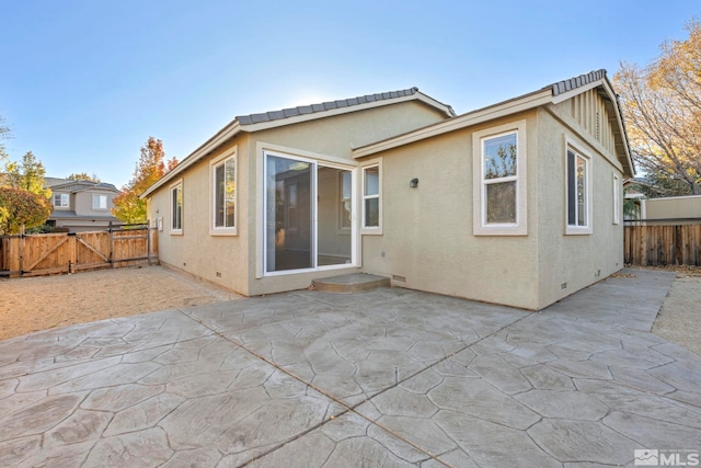 rear view of house featuring a patio