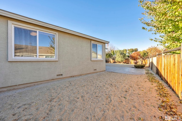 view of home's exterior with a patio area