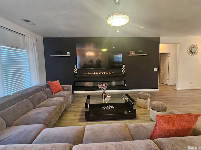 living room with light hardwood / wood-style floors