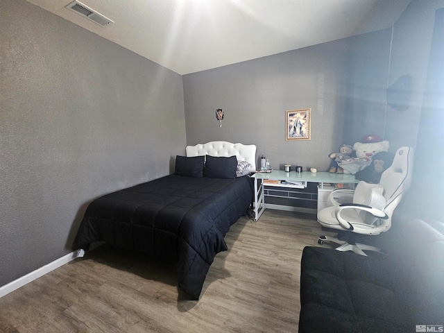 bedroom featuring light hardwood / wood-style flooring