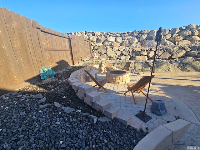 view of patio / terrace with an outdoor fire pit