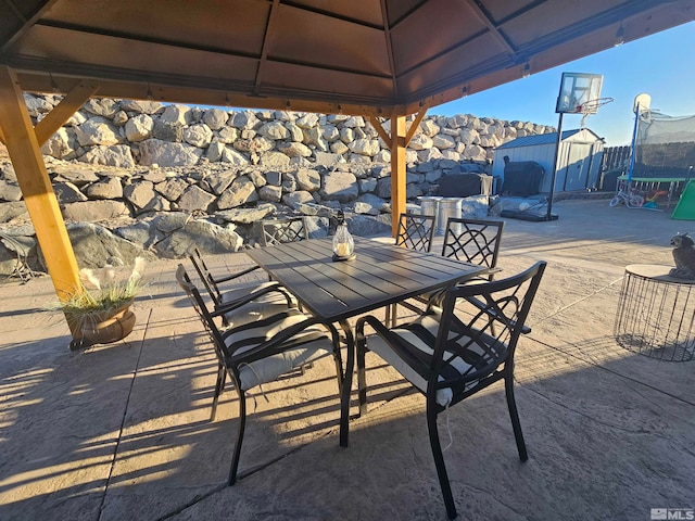 view of patio / terrace with a trampoline and a gazebo