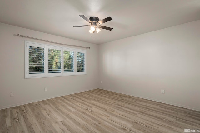 spare room with light hardwood / wood-style flooring and ceiling fan