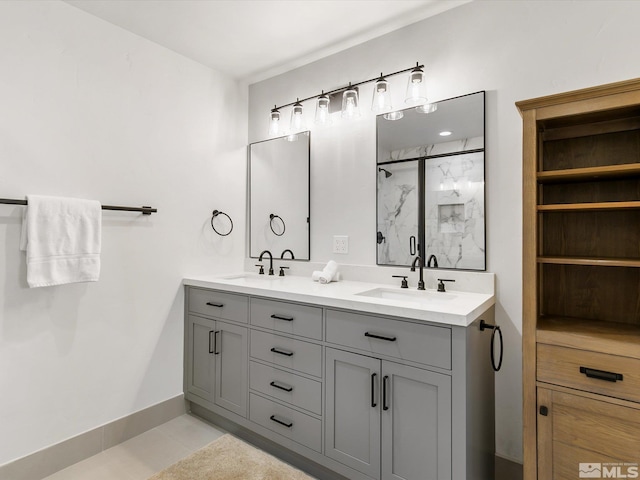 bathroom with tile patterned floors, vanity, and a shower with door