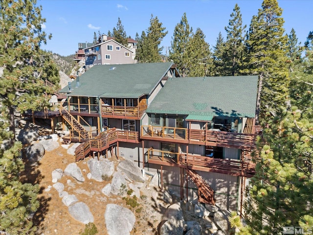 rear view of house with a wooden deck