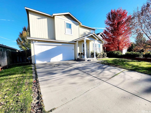 view of front property with a garage and a front yard