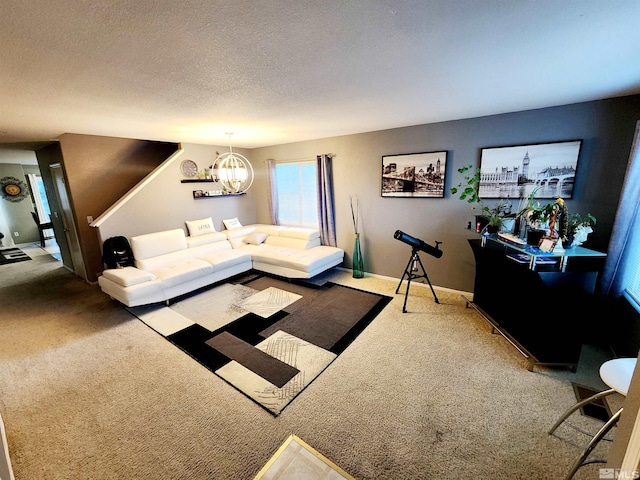 living room with carpet, a notable chandelier, and a textured ceiling