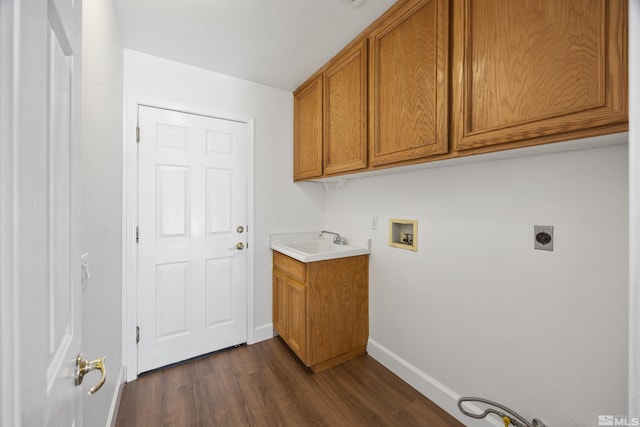 clothes washing area featuring cabinets, sink, washer hookup, electric dryer hookup, and dark wood-type flooring