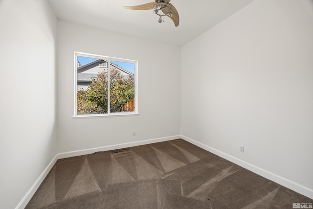 carpeted empty room featuring ceiling fan