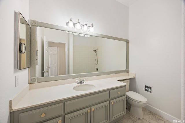 bathroom featuring toilet, a shower, vanity, and tile patterned flooring