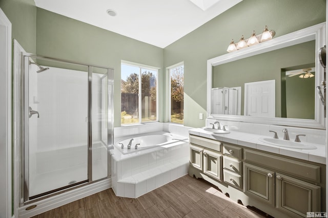 bathroom with independent shower and bath, vanity, and wood-type flooring