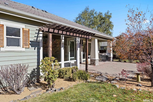 exterior space with a pergola and a patio area