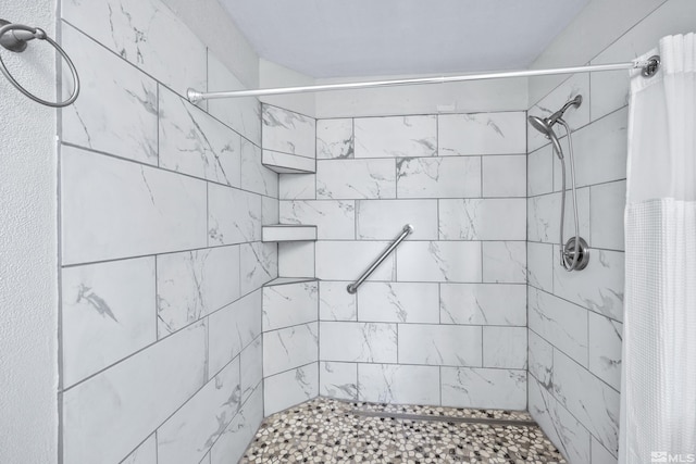 bathroom featuring a shower with curtain