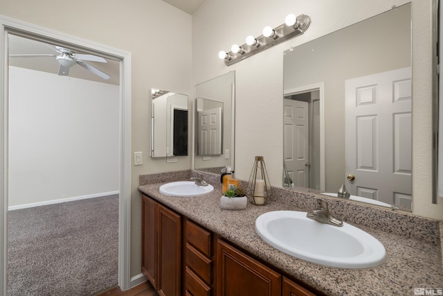 bathroom with ceiling fan and vanity