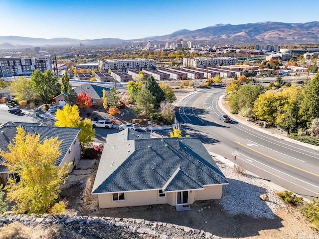 drone / aerial view featuring a mountain view