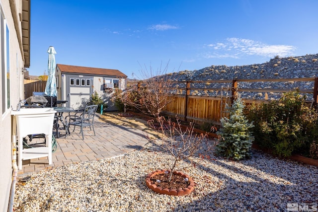 view of patio / terrace featuring a shed