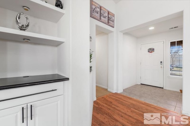 foyer with light tile patterned floors