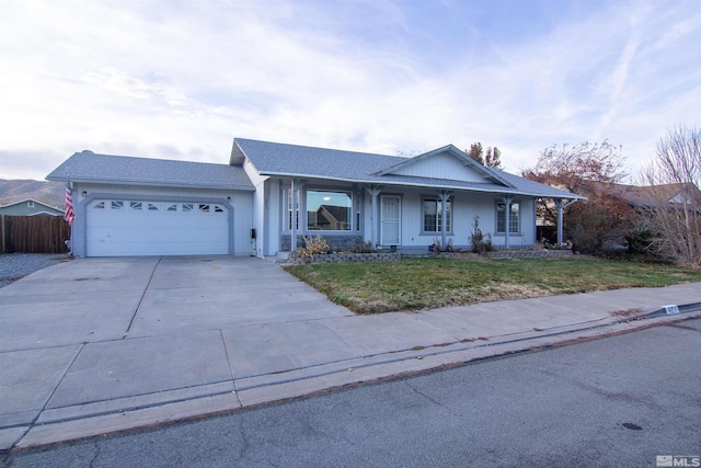 single story home featuring a garage and a porch