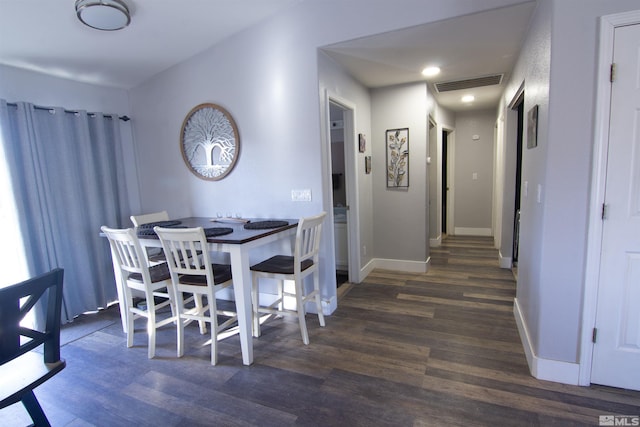 dining area with dark hardwood / wood-style floors