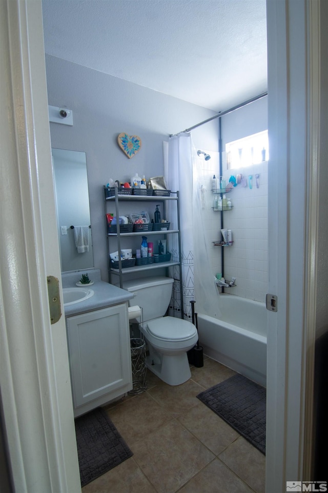 full bathroom featuring toilet, shower / tub combo, vanity, and tile patterned floors