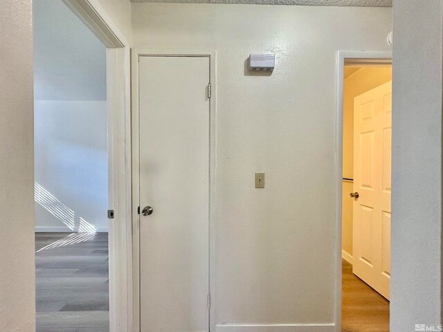 corridor featuring light wood-type flooring