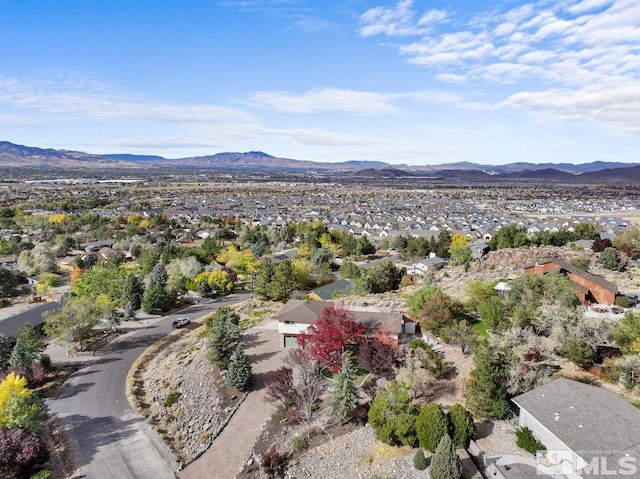 birds eye view of property featuring a mountain view