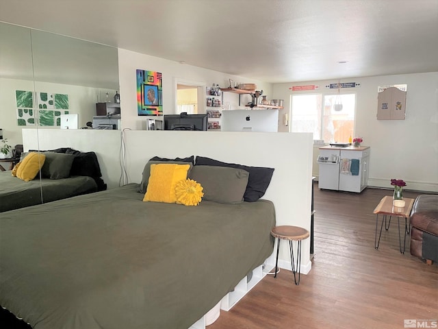 bedroom with wood-type flooring