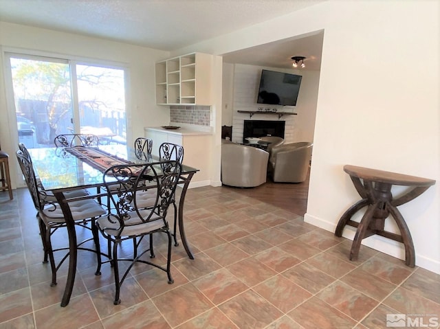 dining area with a fireplace