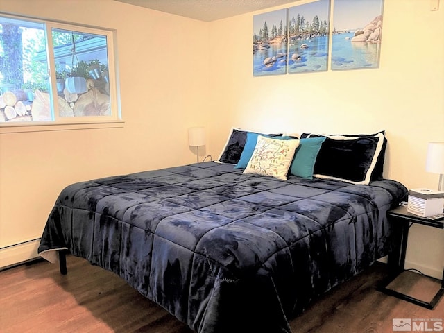 bedroom featuring hardwood / wood-style floors