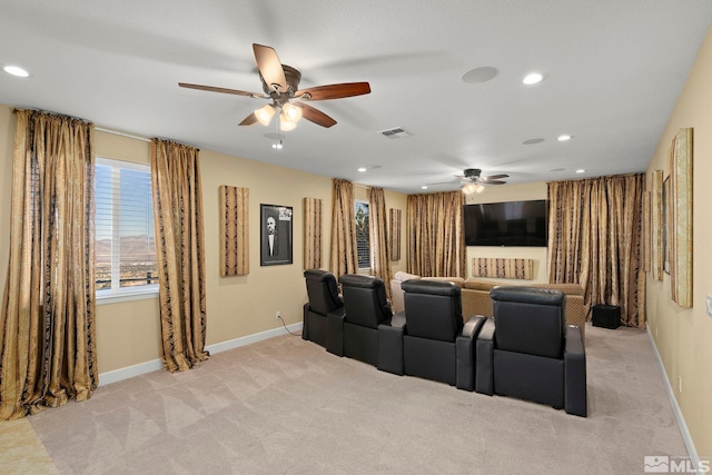 carpeted home theater featuring ceiling fan