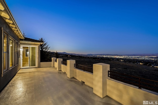 view of patio terrace at dusk