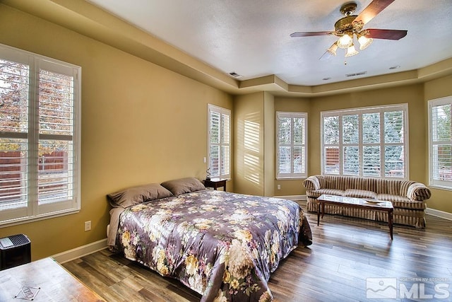 bedroom with hardwood / wood-style flooring and ceiling fan