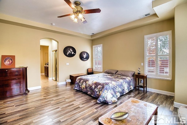 bedroom featuring wood-type flooring and ceiling fan